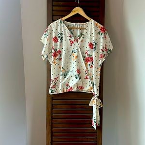 Cream short sleeve blouse with polka dot and floral print elastic/tie waist.